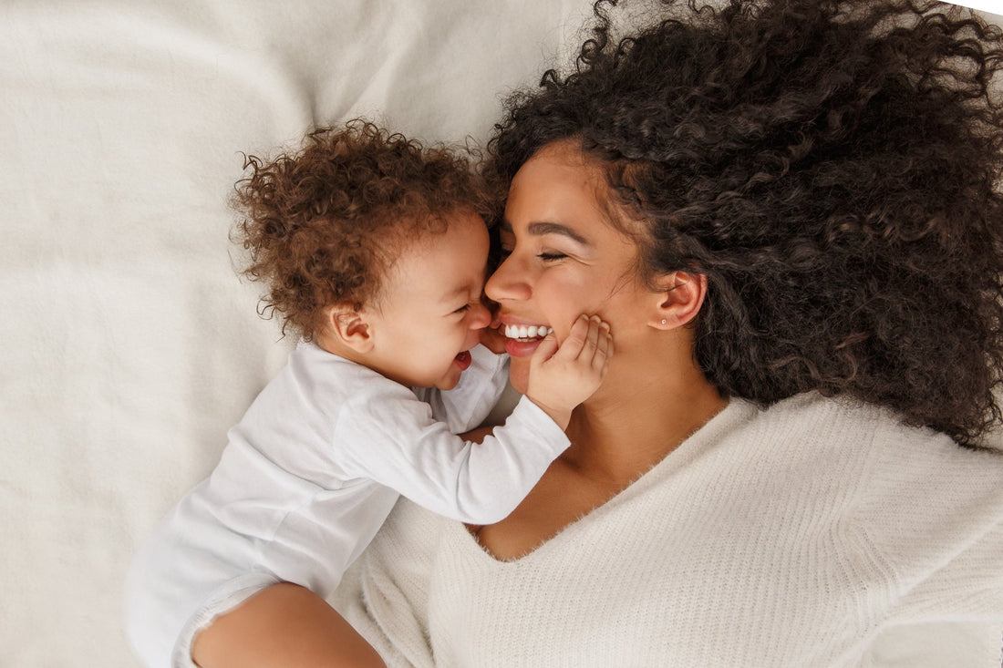 A mother and her newborn baby. If you're skin has changed as a new mom, explore our postpartum skin care guide and discover products that are safer and gentler for you and your baby.