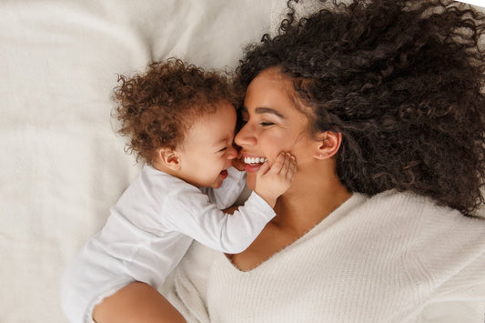 A mother and her newborn baby. If you're skin has changed as a new mom, explore our postpartum skin care guide and discover products that are safer and gentler for you and your baby.