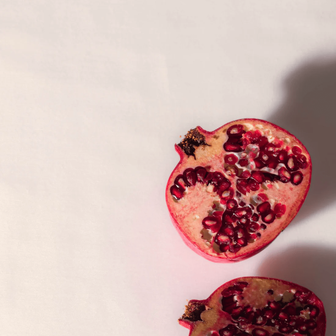 A detail of pomegranate seeds. Learn more about the powerful benefits of pomegranate seed oil, one of the core ingredients in Yay for Earth's Sensitive Skin Face Lotion.