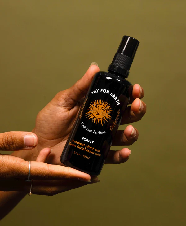 A detail photo of Yay for Earth's Hydrosol Spritzie, a chamomile face toner designed to prime your skin to better absorb the lotion's nutrients or for application anytime to tone, refresh, and soothe the skin.